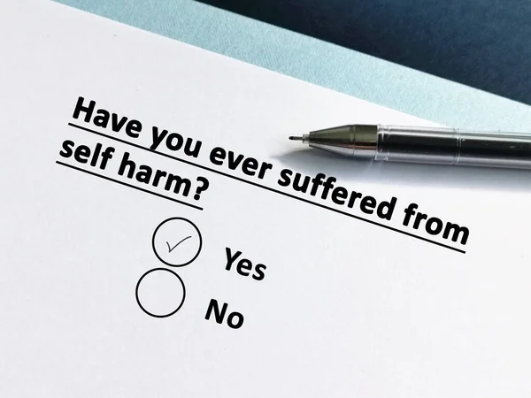 One person is answering question about health. The person has ever suffered from self harm