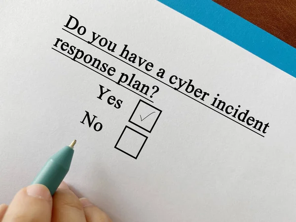 One person is answering question about cyber attack. He has a cyber incident response plan.