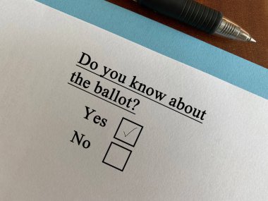 One person is answering question about politics. He knows about the ballot.