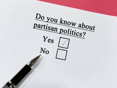 One person is answering question about politics. He knows about partisan politics.