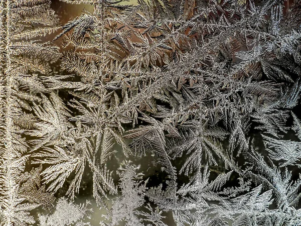 Beautiful frosty patterns on the window glass — Stock Photo, Image