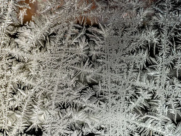 Beautiful frosty patterns on the window glass — Stock Photo, Image