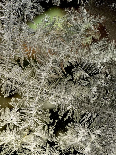 Beautiful frosty patterns on the window glass — Stock Photo, Image