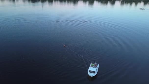 Athlete Gets Water Foilboarding Holding Rope Tied Boat Evening Aerial — 图库视频影像
