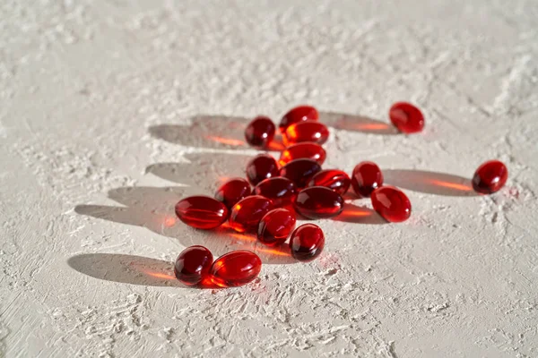 Krill oil soft gel pills rich in omega-3 fatty acids on a bright background with copy space