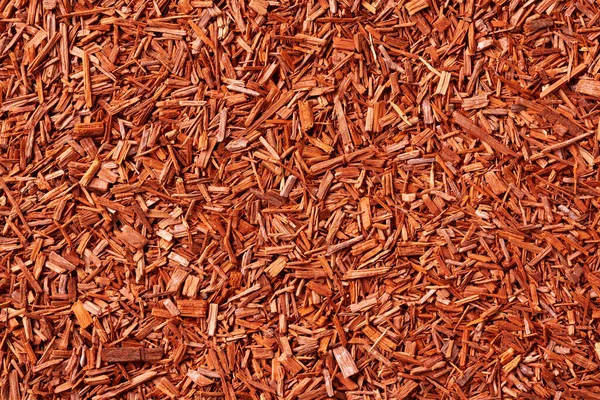 Rode Achtergrond Gemaakt Van Sandelhout Chips Bovenaanzicht — Stockfoto