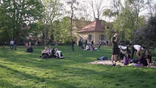 Prague Czech Republic April 2022 People Sitting Lawn Some Disguised — Stock Video