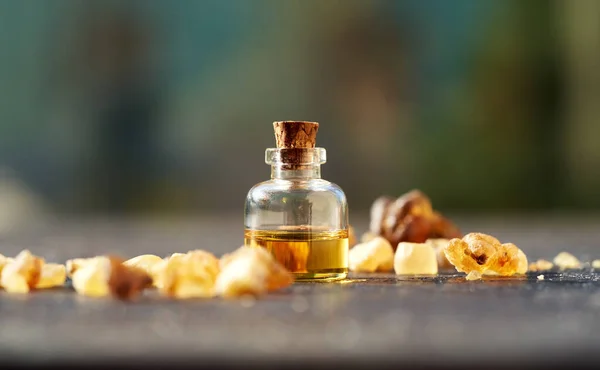 Glass Bottle Aromatherapy Essential Oil Frankincense Resin Table Outdoors — Stock Photo, Image