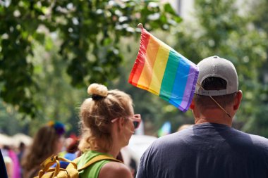 PRAGUE, CZECH REPUBLIC - AUGUST 13, 2022: Man with colorful rainbow flag at LGBT pride