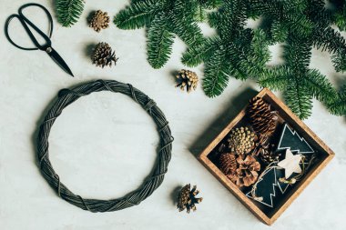 Process of making christmas wreath for home interior. Christmas decorating for winter holiday. Step by step, process. DIY, crafting, hobby concept