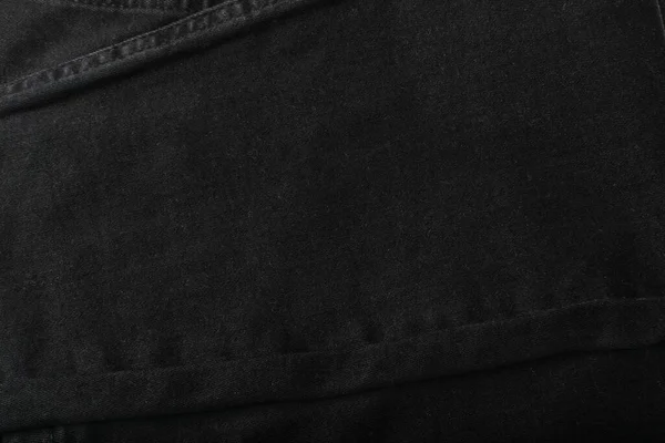 黑色牛仔裤纹理背景 深色棉织物图案 有仿制空间的服装 棉织物模型 — 图库照片