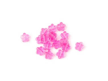 Pink bead flowers isolated. Beading craft accessory, flower beads pile, beadwork handicraft elements on white background top view