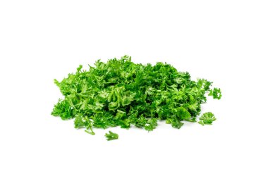 Fresh green chopped parsley leaves pile isolated on white background. Spicy aromatic sliced raw herbs of garden parsley. Cilantro or corriender leaves pieces side view
