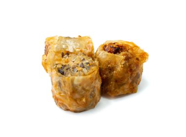 Spring rolls isolated. Rollos primavera pieces, fried rollito, arrollado, lumpia cuts, popiah, nem, sajgonki or fried dim sim pile on white background