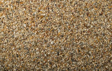 Kaba kum dokusu arka planı. Su filtresi ince çakıl, havuz filtresi için kum, kopya alanı olan küçük kaya deseni
