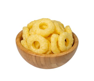 Corn rings pile isolated. Cereal puffs with spices, round crunchy puffed snacks, breakfast corn rings on white background