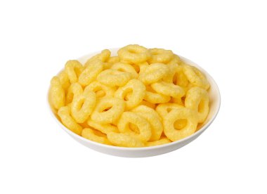Corn rings pile isolated. Cereal puffs with spices, round crunchy puffed snacks, breakfast corn rings on white background