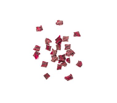 Dry beetroot cubes isolated. Dried diced red beet pile, scattered small beet root pileces, dry beetroot flakes on white background top view