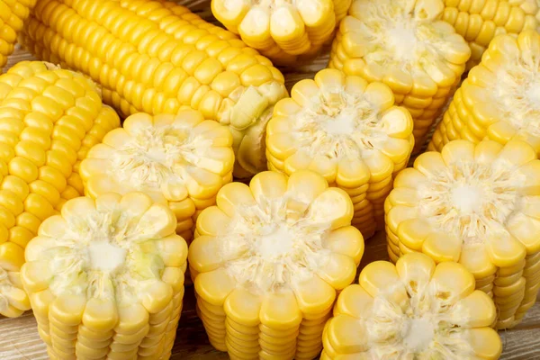 Sweet corn ears closeup. Maize cob group, autumn sweetcorn, corncob close up, yellow corn ear textured background