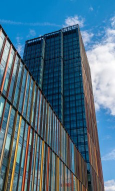 Modern office buildings, new business center facade on blue sky background, editorial image view