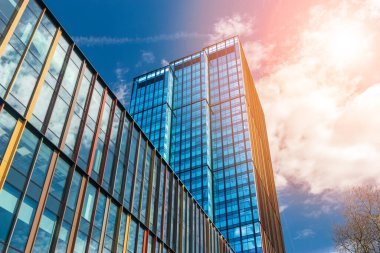 Modern office buildings, new business center facade on blue sky background, editorial image view