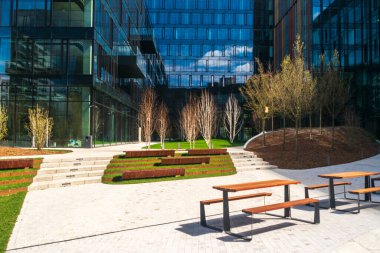 Modern office buildings, new business center facade on blue sky background, editorial image view