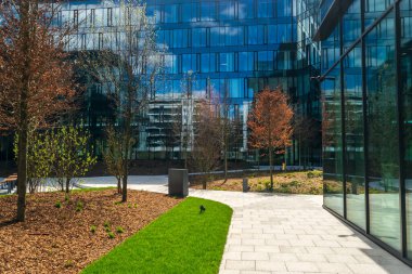 Modern office buildings, new business center facade on blue sky background, editorial image view