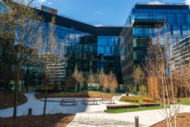 Modern office buildings, new business center facade on blue sky background, editorial image view