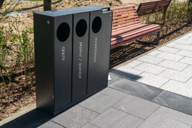 Modern garbage bins, smart metal trash can on street. New waste bin for separate trash and recyclable waste