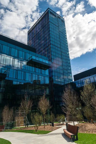 Modern office buildings, new business center facade on blue sky background, editorial image view