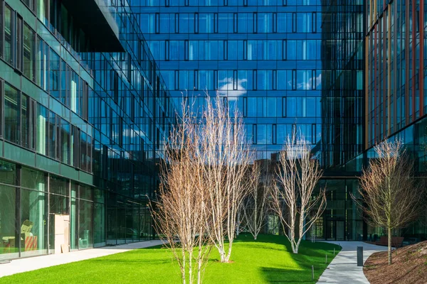 Modern office buildings, new business center facade on blue sky background, editorial image view