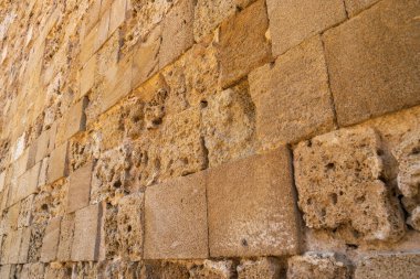 Ancient stone wall texture background. Medieval brick fence, antique stonewall, old historic castle wall