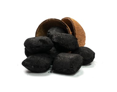 Coconut coal briquette isolated. Pressed charcoal for braai, coconut barbecue coal, bbq briquettes, grill charcoal on white background