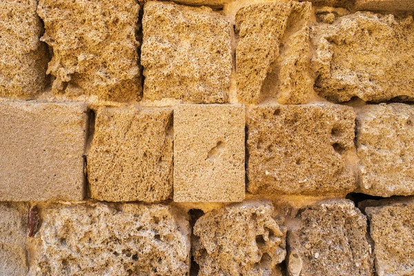 Ancient stone wall texture background. Medieval brick fence, antique stonewall, old historic castle wall