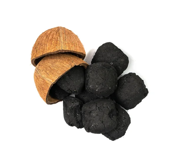 Coconut coal briquette isolated. Pressed charcoal for braai, coconut barbecue coal, bbq briquettes, grill charcoal on white background
