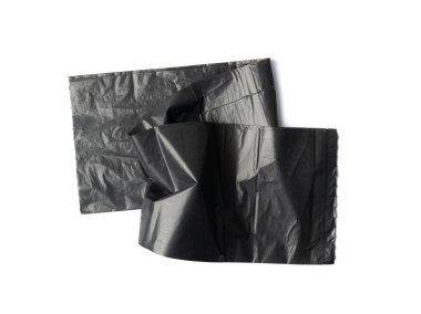 Empty folded garbage bag isolated. Trash package top view, new plastic bin bags, black polyethylene waste container on white background