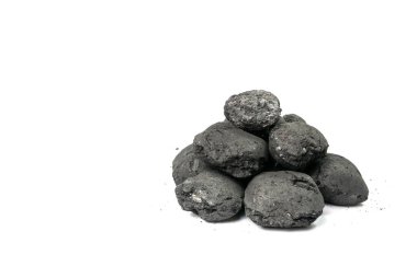Coal briquette isolated. Pressed charcoal for braai, coconut barbecue coal, bbq briquettes, grill charcoal on white background