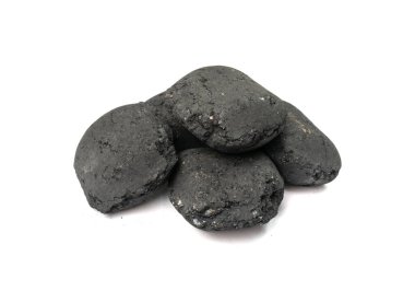 Coal briquette isolated. Pressed charcoal for braai, coconut barbecue coal, bbq briquettes, grill charcoal on white background