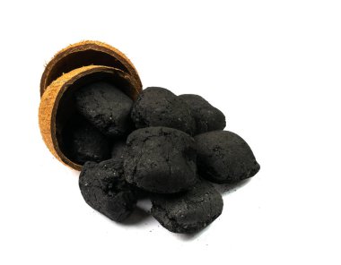Coconut coal briquette isolated. Pressed charcoal for braai, coconut barbecue coal, bbq briquettes, grill charcoal on white background