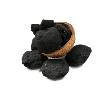 Coconut coal briquette isolated. Pressed charcoal for braai, coconut barbecue coal, bbq briquettes, grill charcoal on white background