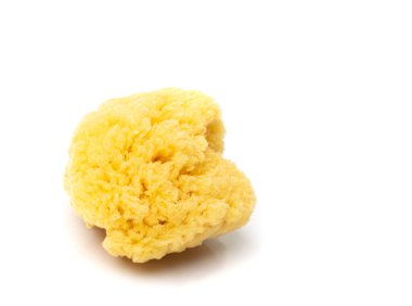 Natural sponge isolated. Yellow sponges closeup, eco body care concept, eco friendly hygiene accessory on a white background