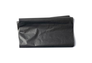 Empty folded garbage bag isolated. Trash package top view, new plastic bin bags, black polyethylene waste container on white background