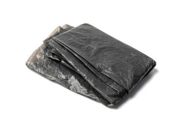 Empty folded garbage bag isolated. Trash package top view, new plastic bin bags, used black polyethylene waste container on white background