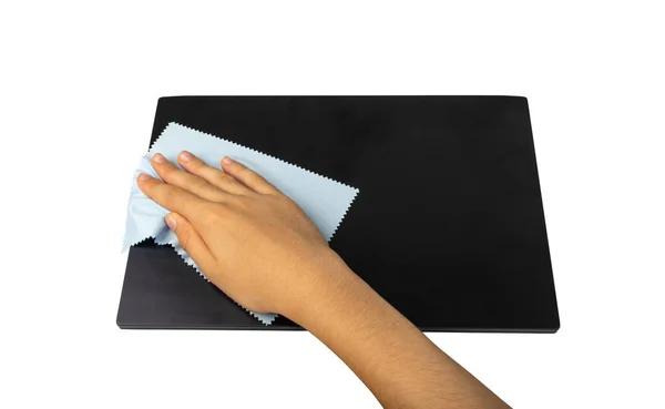 Wipe closed laptop isolated. Hand cleaning pc with blue cloth, wiping black notebook, computer care, cleaning device on white background, clipping path