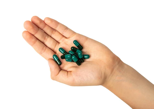 Black Green Pills Hand Capsule Pile Isolated Hand Holds Drugs — Zdjęcie stockowe