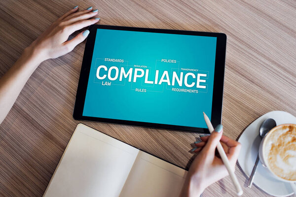 Compliance concept with icons and diagrams. Regulations, law, standards, requirements, audit. Concept on device screen