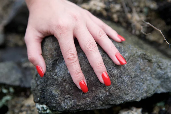 Brush Beautiful Female Hand Lies Stone Manicure Done Red Lacquer — Stock Photo, Image