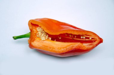 sliced red pepper on a light background, close-up, sweet red bell pepper,