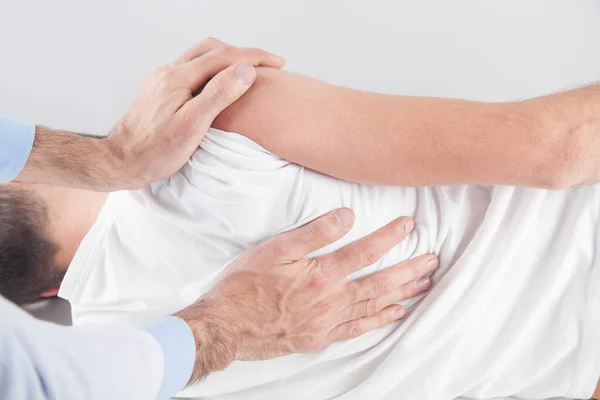 Caucasian Doctor Massaging Patient Shoulder — Stock Photo, Image
