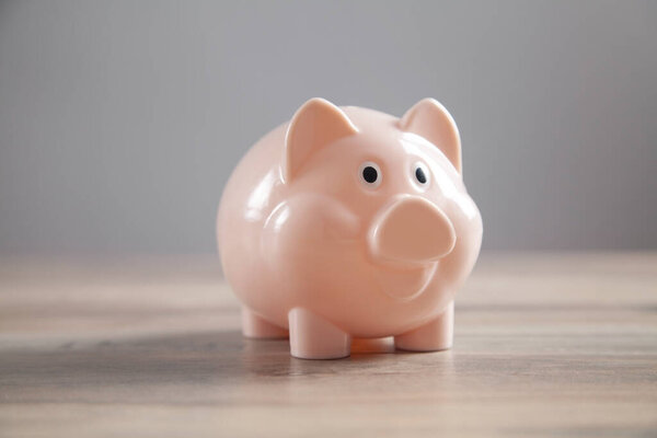 Piggy bank on the desk. Saving. Business